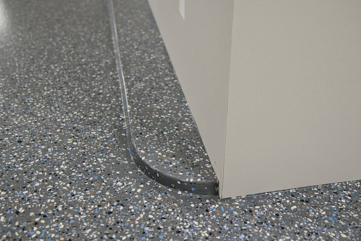 Flake coverage at floor edge.